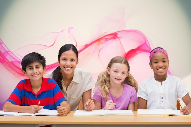 Photo pretty teacher helping pupils in library against pink abstract design