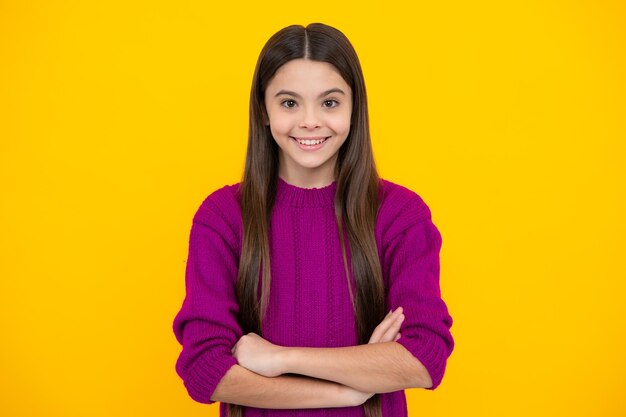 Pretty teen girl headshot portrait adorable little girl child isolated on a yellow background