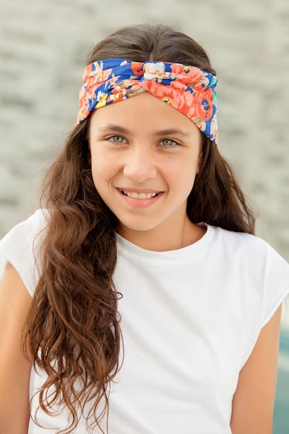 Pretty teenager girl with a flowered headband