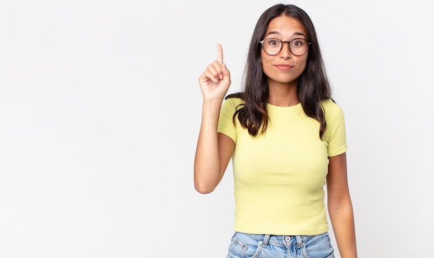 Pretty thin hispanic woman feeling like a genius idea