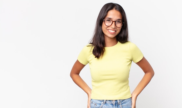 Pretty thin hispanic woman smiling cheerfully and casually