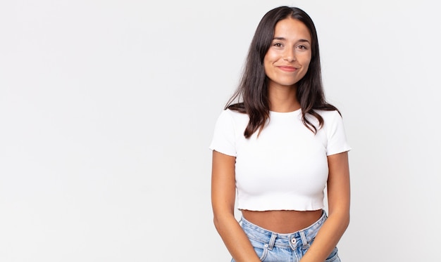 Pretty thin hispanic woman smiling positively and confidently