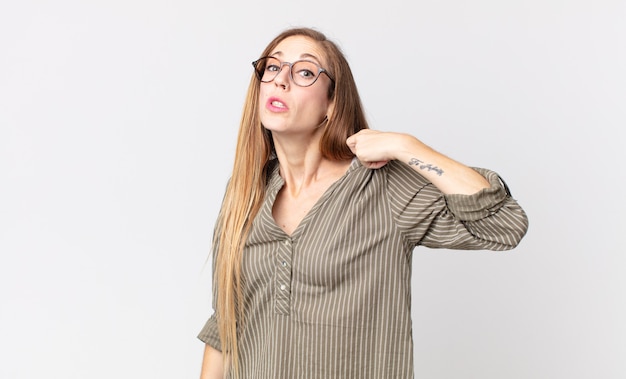 Pretty thin woman feeling stressed, anxious, tired and frustrated, pulling shirt neck, looking frustrated with problem