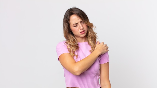 pretty thin woman feeling tired, stressed, anxious, frustrated and depressed, suffering with back or neck pain