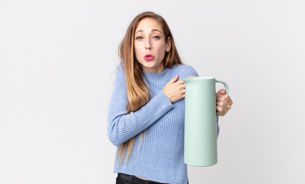 Pretty thin woman with a coffee thermos