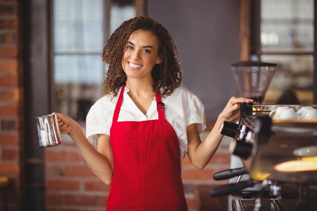 A pretty waitress holding a jug