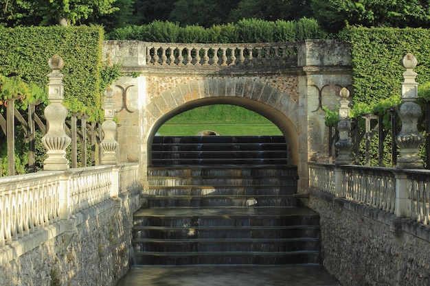 Pretty waterfall over stairs in the gardens of the Château de Villandry.