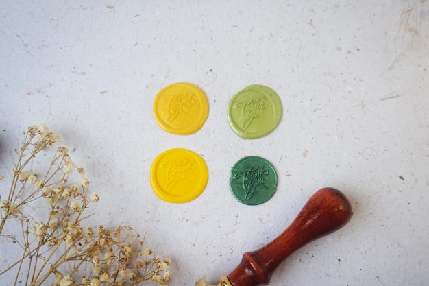 Pretty wax coins made from wax bead and stamp for a vintage look in letter or wedding invitation