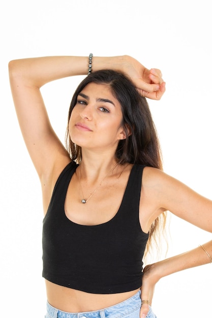 Pretty woman arm above head in front of white background