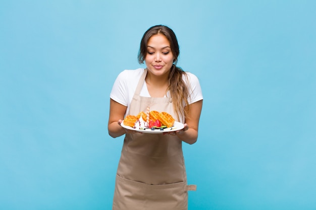 Pretty woman in baker uniform