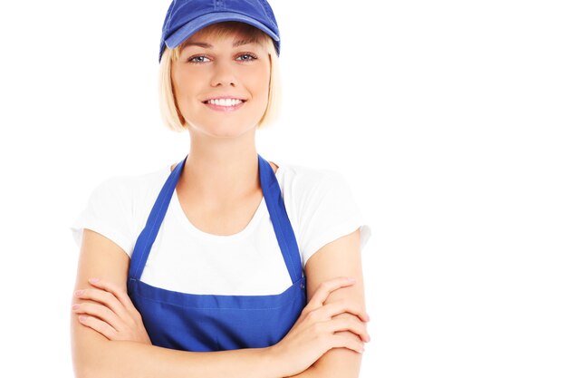 Foto una bella donna in uniforme blu su sfondo bianco