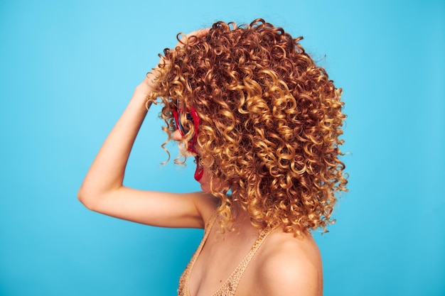 Pretty Woman Curly hair closeup side view of the model red heart glasses