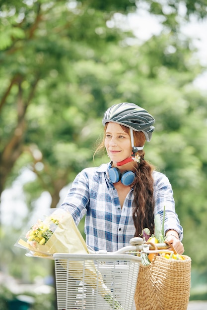 Pretty woman cycling in summer