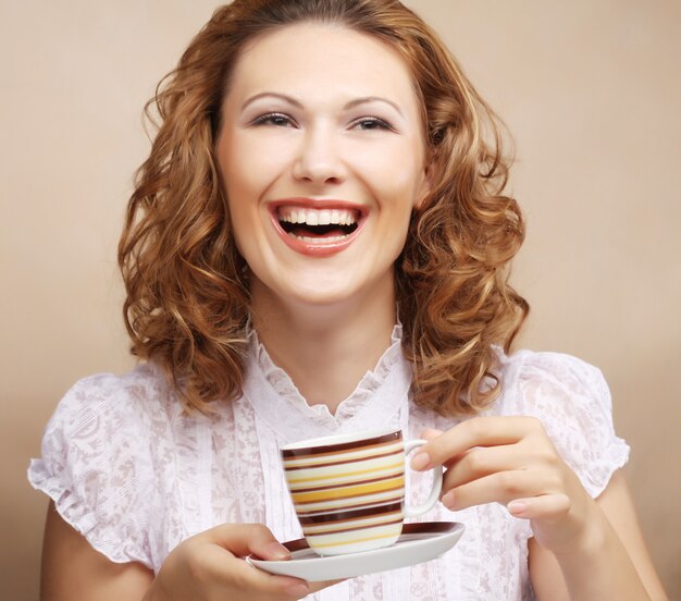 Pretty woman drinking coffee