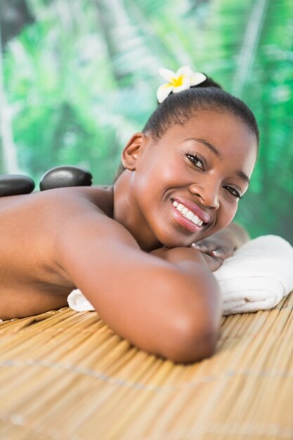 Pretty woman enjoying a hot stone massage