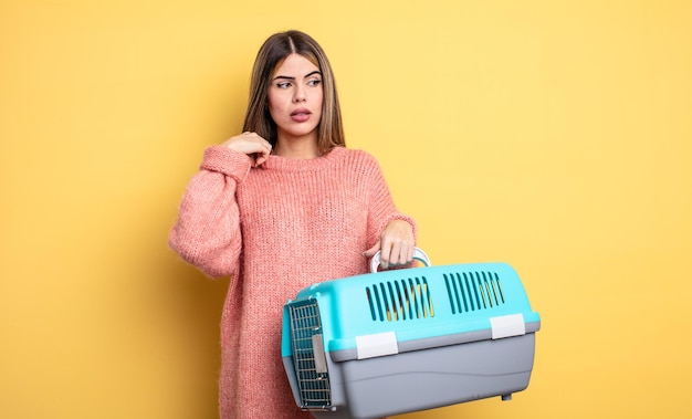 Pretty woman feeling stressed, anxious, tired and frustrated. pet carrier concept