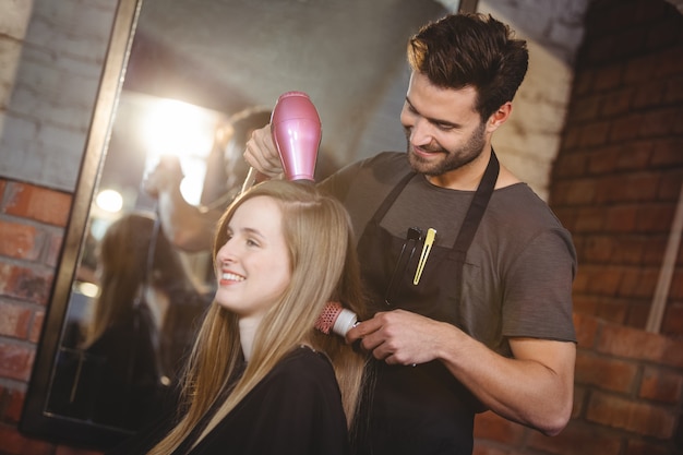 Pretty woman getting her hair dried