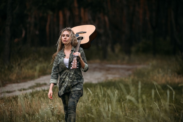 Pretty woman guitar nature fashion look concept. Unity with nature. Music in heart.