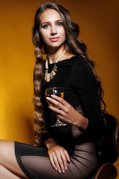 Pretty woman holding a glass of champagne