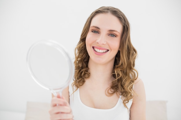 Pretty woman holding a mirror