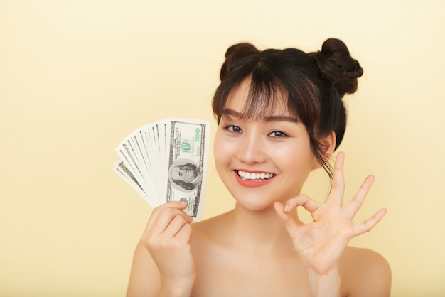 Pretty Woman Holding Money