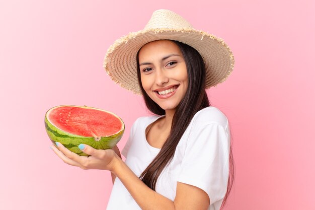 Pretty woman holding a watermelon slice