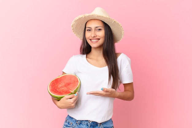 pretty woman holding a watermelon slice