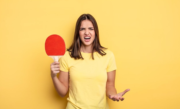 Pretty woman looking angry, annoyed and frustrated. ping pong concept