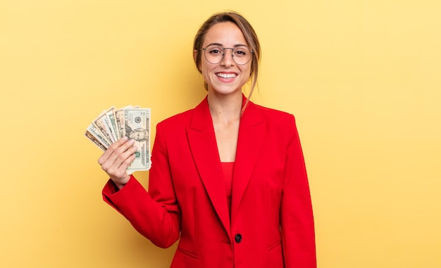 Pretty woman looking happy and pleasantly surprised. business and dollar banknotes concept