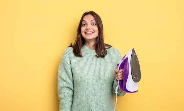 Pretty woman looking happy and pleasantly surprised iron clothes concept