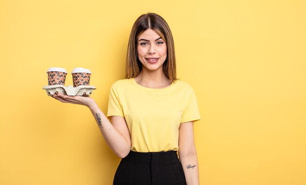 Pretty woman looking happy and pleasantly surprised take away coffees concept