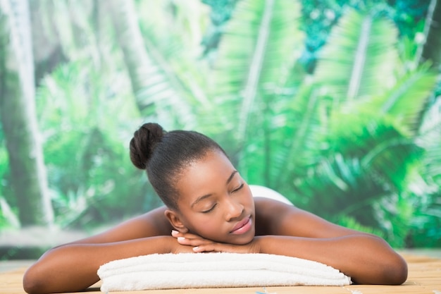 Pretty woman lying on massage table 