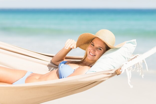 Pretty woman relaxing in the hammock