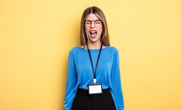 Photo pretty woman shouting aggressively looking very angry accreditation card concept