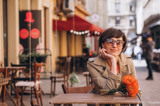 Pretty woman sitting in cafe in china town