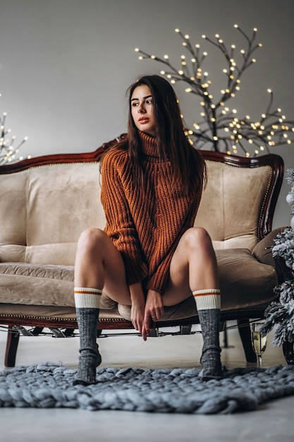 Pretty woman in sweater and lingerie