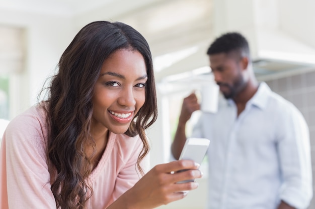 Pretty woman using her smartphone