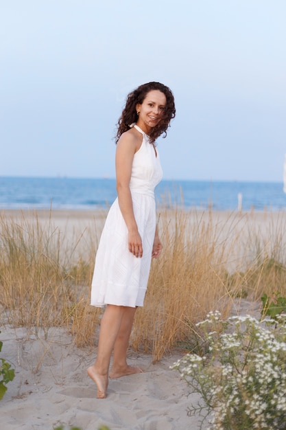 Pretty woman walking on the beach