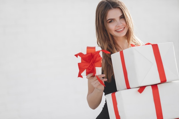 pretty woman with gift boxes outdoor