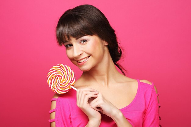 Photo pretty woman with lollipop