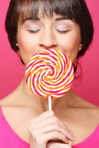 Pretty woman with lollipop