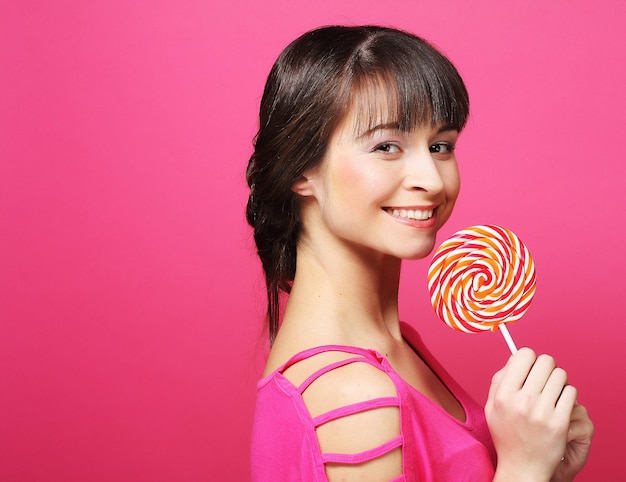 Pretty woman with lollipop