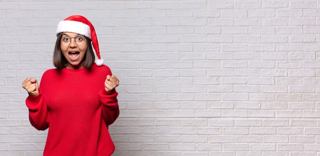 Pretty woman with santa hat