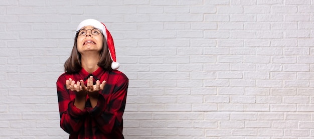 Pretty woman with santa hat