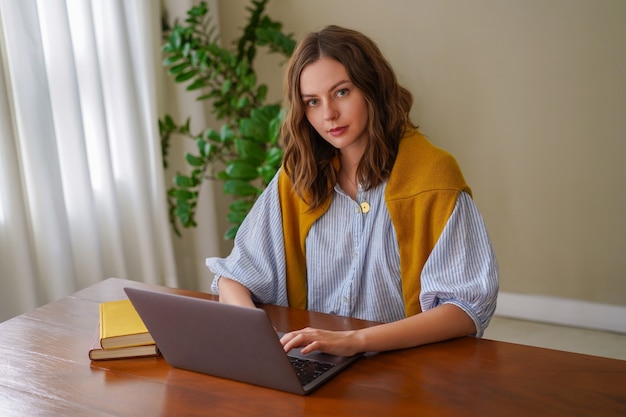 Pretty woman working at her home office