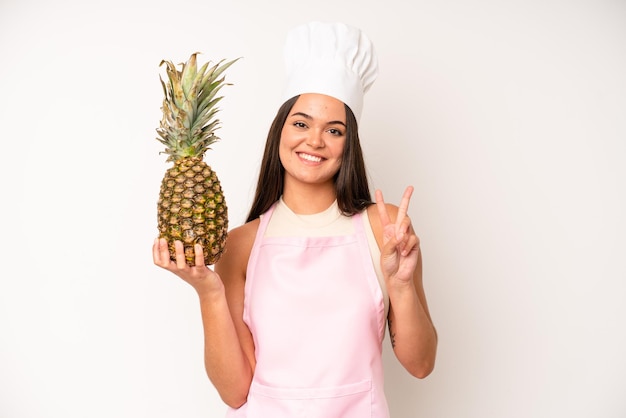 Pretty young adult woman chef and ingredients healthy food concept