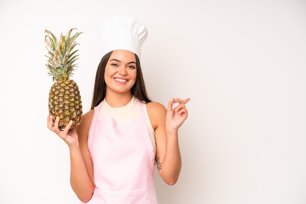 Pretty young adult woman chef and ingredients healthy food concept