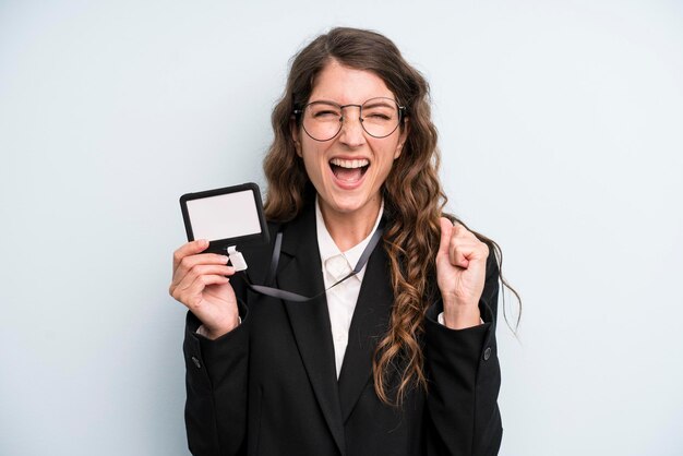 Pretty young adult woman showing an access card