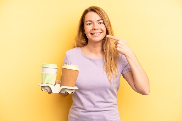 Pretty young adult woman take away coffee concept