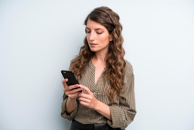 Pretty young adult woman using her smart phone